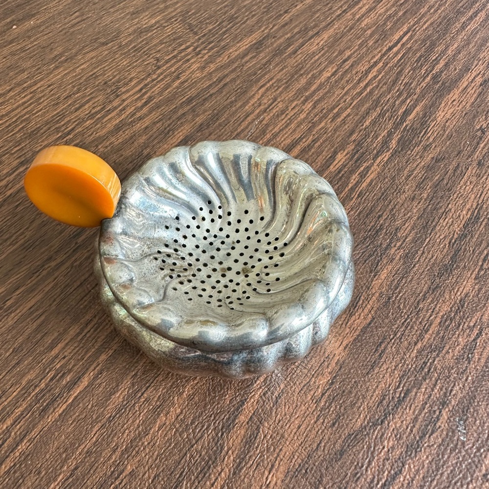 Vintage Silver Metal Tea Strainer with Orange Bakelite Handle